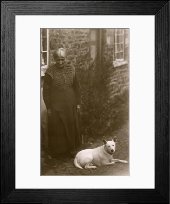 Framed Print : Old lady with a white dog Framed Print : Old lady with a white dog