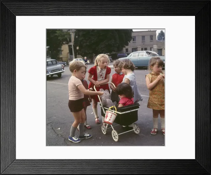 Framed Print : Children with toy pram, Balham, SW London Framed Print : Children with toy pram, Balham, SW London