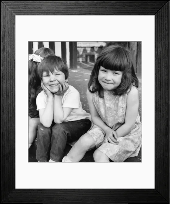 Framed Print : Children sittiing on kerb, Balham, SW London Framed Print : Children sittiing on kerb, Balham, SW London