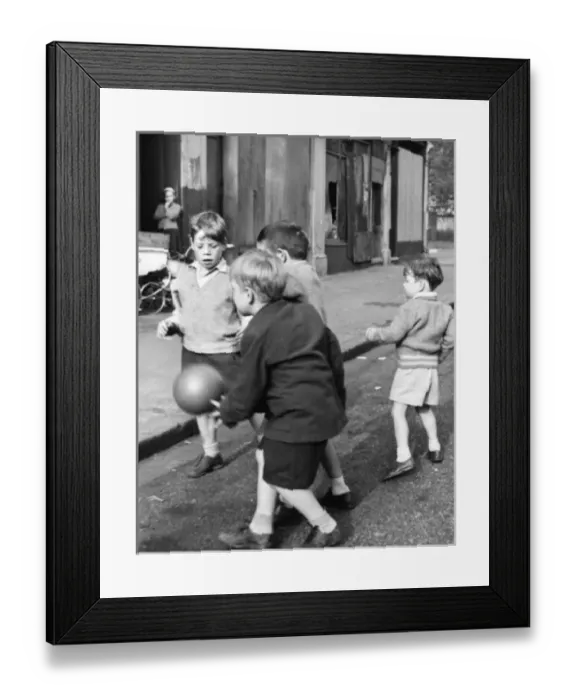 Framed Print : Boys playing football in a street, Balham, SW London Framed Print : Boys playing football in a street, Balham, SW London