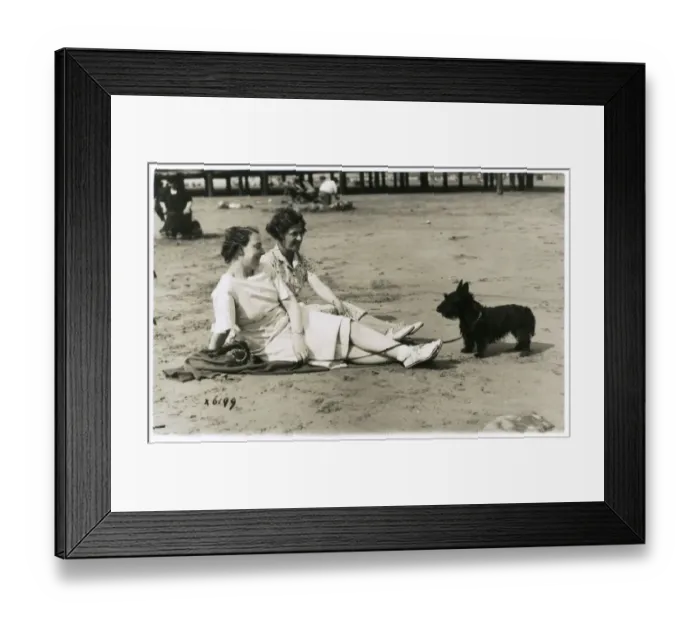 Framed Print : Two women on beach with Scots terrier Framed Print : Two women on beach with Scots terrier