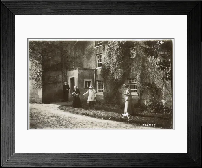Framed Print : People and dog outside a large house Framed Print : People and dog outside a large house