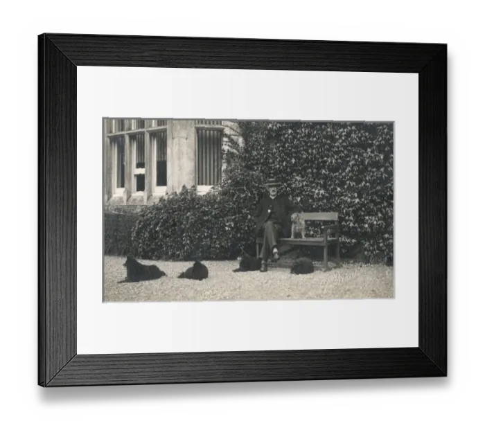 Framed Print : Man and four dogs outside a large house Framed Print : Man and four dogs outside a large house