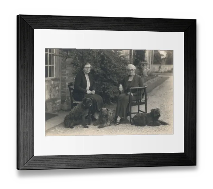 Framed Print : Two women and three dogs in a garden Framed Print : Two women and three dogs in a garden