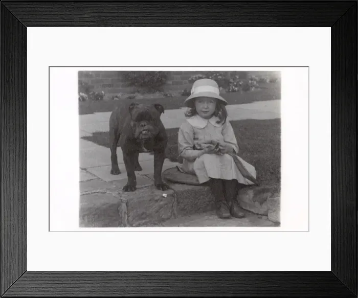 Framed Print : Little girl and bulldog in a garden Framed Print : Little girl and bulldog in a garden
