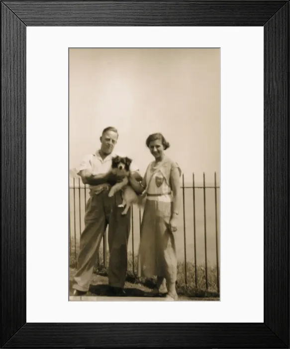 Framed Print : Couple with a dog at a seaside resort Framed Print : Couple with a dog at a seaside resort