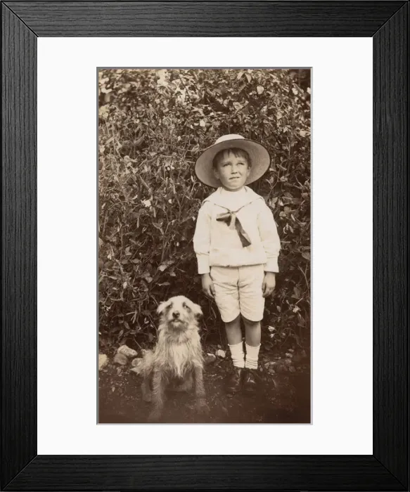 Framed Print : Boy with a terrier dog in a garden Framed Print : Boy with a terrier dog in a garden
