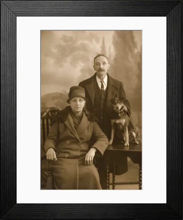 Framed Print : Studio portrait, couple with puppy Framed Print : Studio portrait, couple with puppy