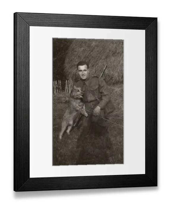 Framed Print : Man in uniform with a terrier dog at a farm Framed Print : Man in uniform with a terrier dog at a farm