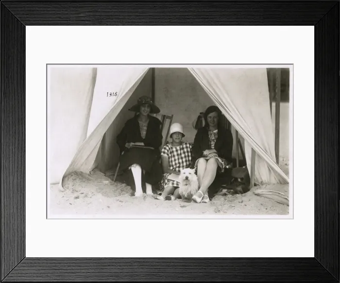 Framed Print : Three women in a tent on a beach with a white terrier Framed Print : Three women in a tent on a beach with a white terrier
