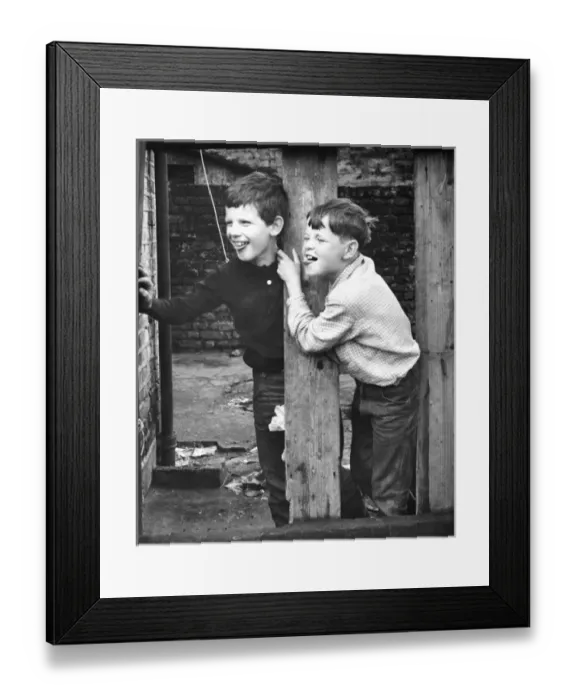 Framed Print : Two boys playing on a Balham street, SW London Framed Print : Two boys playing on a Balham street, SW London