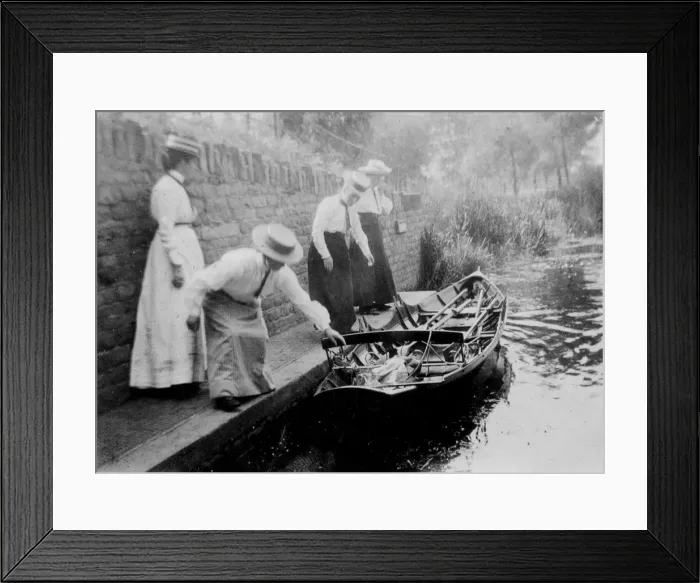 Framed Print : Women getting onto rowing boat Framed Print : Women getting onto rowing boat
