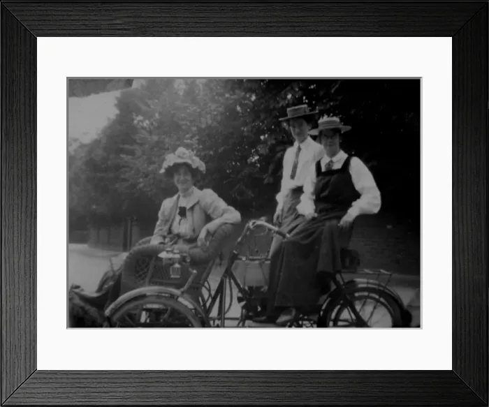 Framed Print : Woman and students on motorised bicycle Framed Print : Woman and students on motorised bicycle