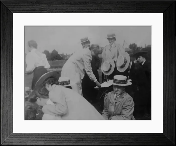 Framed Print : Group checking a score or a map Framed Print : Group checking a score or a map