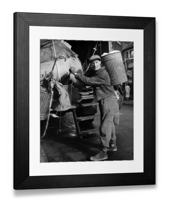 Framed Print : Refuse collector at work on a Balham street, SW London Framed Print : Refuse collector at work on a Balham street, SW London
