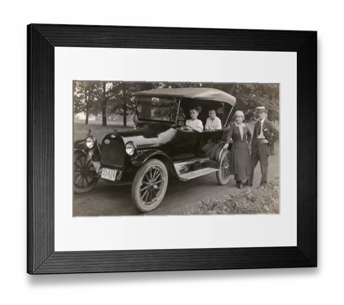 Framed Print : Family of four with their car, Rhode Island, USA Framed Print : Family of four with their car, Rhode Island, USA