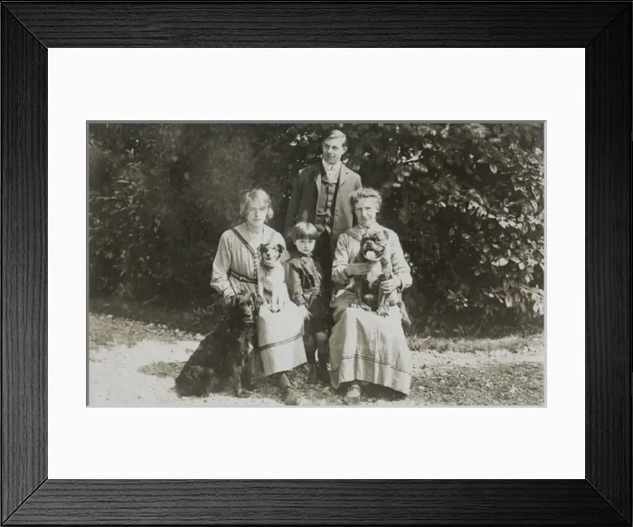Framed Print : Four people and three dogs in a garden Framed Print : Four people and three dogs in a garden