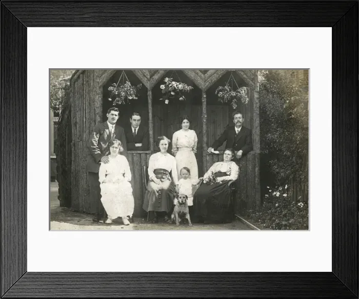 Framed Print : Eight people with a dog in a garden Framed Print : Eight people with a dog in a garden