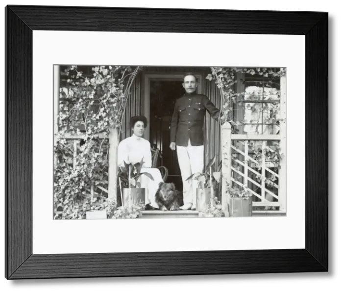 Framed Print : Young couple and a dog on a garden porch Framed Print : Young couple and a dog on a garden porch