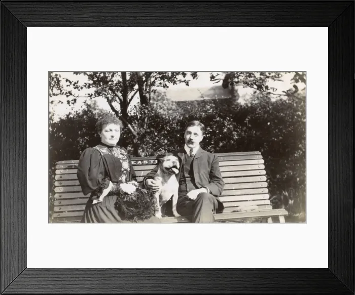 Framed Print : Couple on a bench with a dog Framed Print : Couple on a bench with a dog
