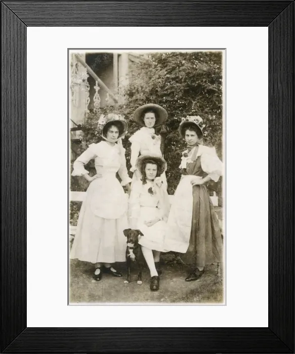 Framed Print : Four young women and a dog in a garden Framed Print : Four young women and a dog in a garden