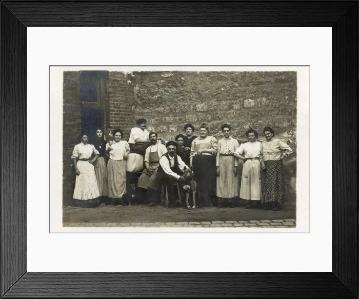 Framed Print : Group of working people with a dog, France Framed Print : Group of working people with a dog, France