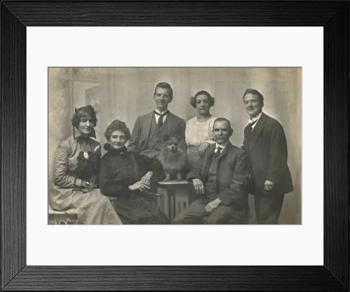 Framed Print : Family group studio portrait with small dog Framed Print : Family group studio portrait with small dog