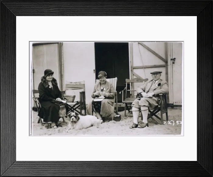 Framed Print : Three people and a dog on the beach Framed Print : Three people and a dog on the beach