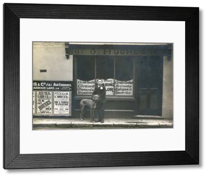 Framed Print : Boy and dog on a pavement, South London Framed Print : Boy and dog on a pavement, South London