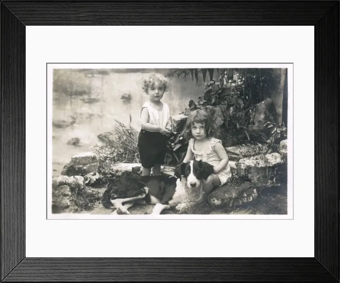 Framed Print : Two children with a dog in a garden, France Framed Print : Two children with a dog in a garden, France