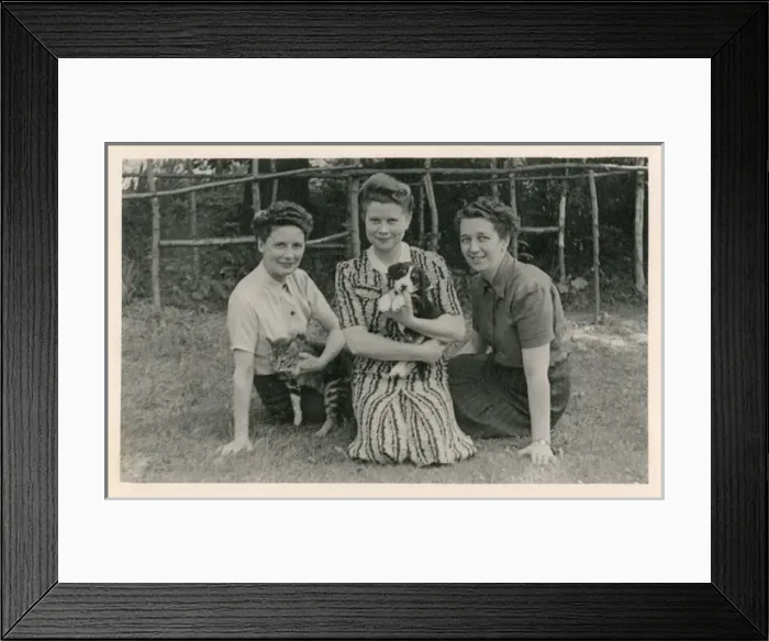 Framed Print : Three women with cat and puppy in a garden Framed Print : Three women with cat and puppy in a garden
