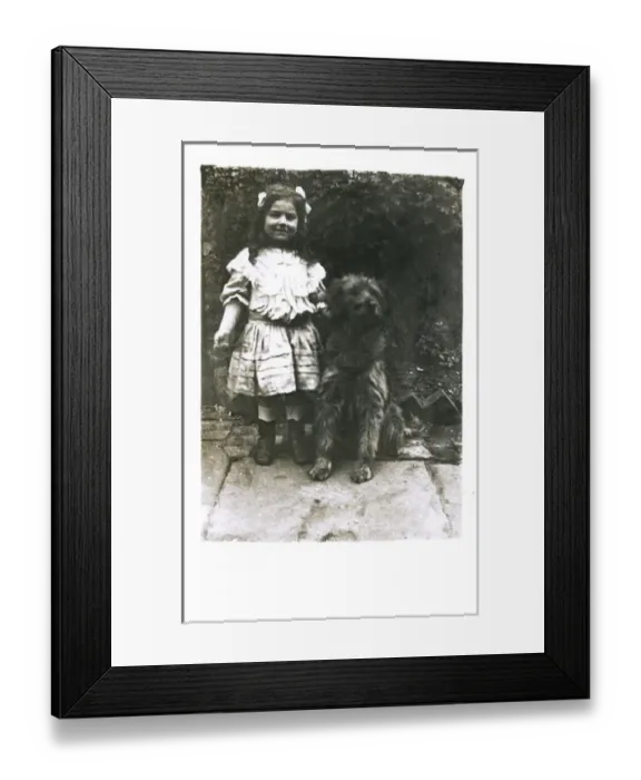 Framed Print : Little girl with a dog in a garden Framed Print : Little girl with a dog in a garden