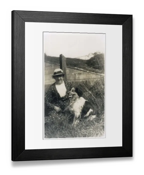 Framed Print : Woman with a dog in a field Framed Print : Woman with a dog in a field