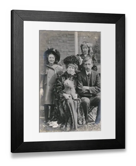 Framed Print : Family of four with a dog in a garden Framed Print : Family of four with a dog in a garden