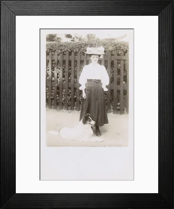 Framed Print : Woman taking a dog for a walk Framed Print : Woman taking a dog for a walk