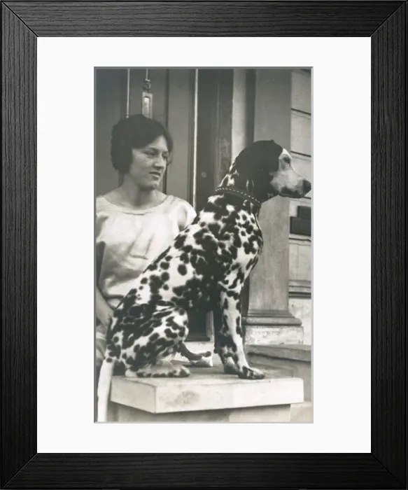 Framed Print : Woman with Dalmatian outside a house Framed Print : Woman with Dalmatian outside a house