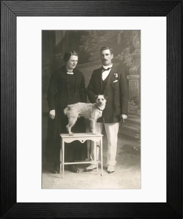Framed Print : Studio portrait, couple with dog Framed Print : Studio portrait, couple with dog