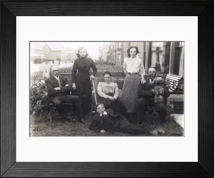 Framed Print : Family of six with a dog in a front garden Framed Print : Family of six with a dog in a front garden