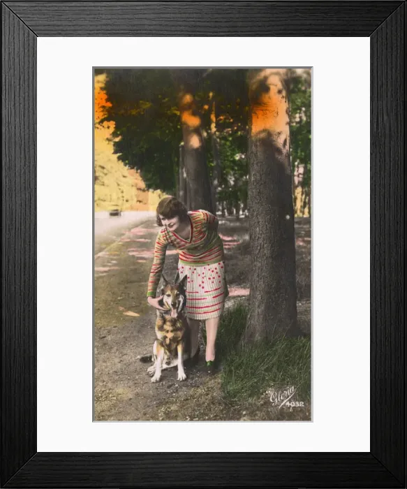 Framed Print : Young woman with a German Shepherd dog, France Framed Print : Young woman with a German Shepherd dog, France