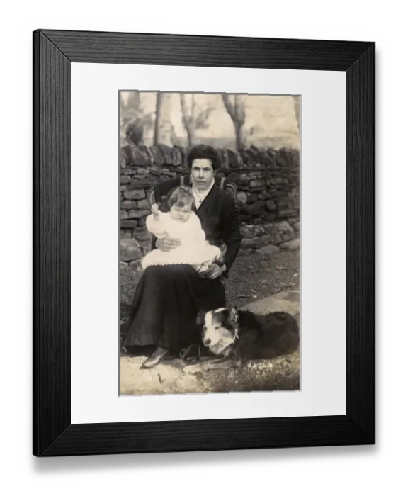 Framed Print : Woman and baby with a dog in a garden Framed Print : Woman and baby with a dog in a garden