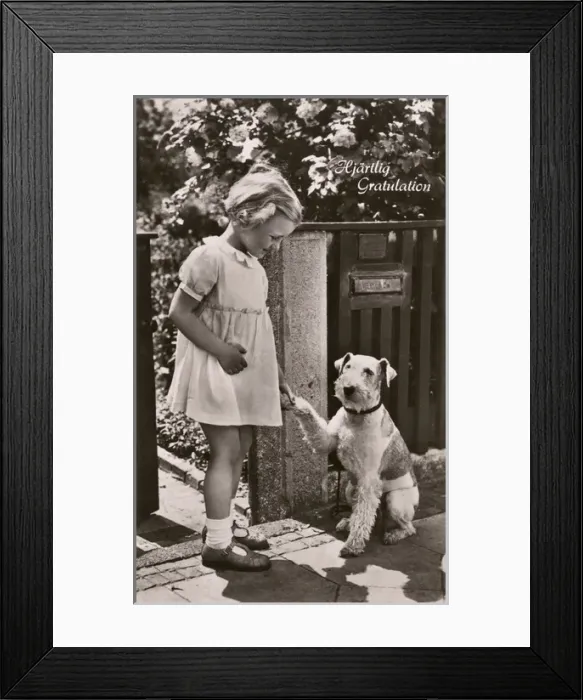 Framed Print : Little girl and dog on a greetings postcard, Sweden Framed Print : Little girl and dog on a greetings postcard, Sweden