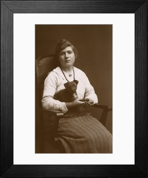 Framed Print : Studio portrait, woman with puppy Framed Print : Studio portrait, woman with puppy