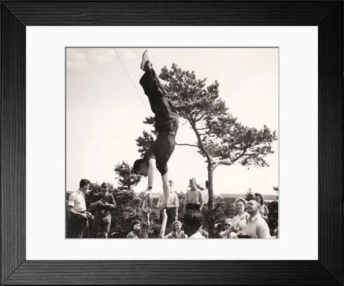 Framed Print : Handstand on tree stump with onlookers Framed Print : Handstand on tree stump with onlookers