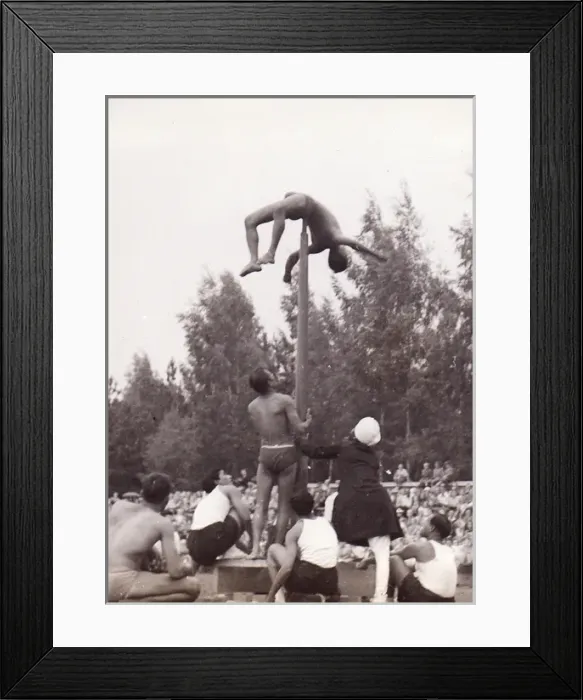 Framed Print : Male gymnast on pole with spectators Framed Print : Male gymnast on pole with spectators