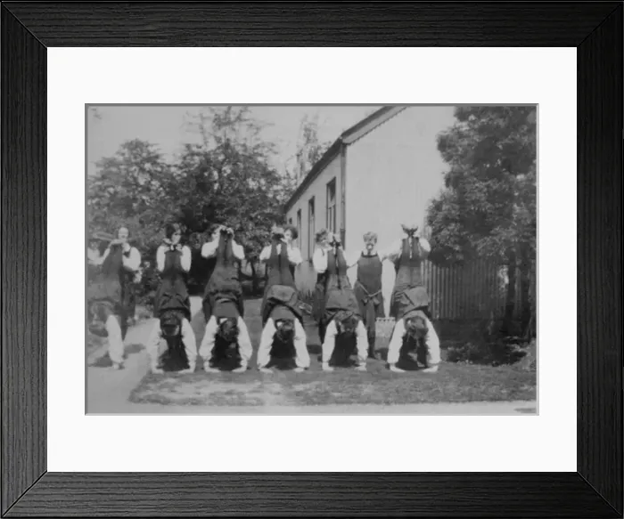 Framed Print : Student pairs wheelbarrow type support Framed Print : Student pairs wheelbarrow type support