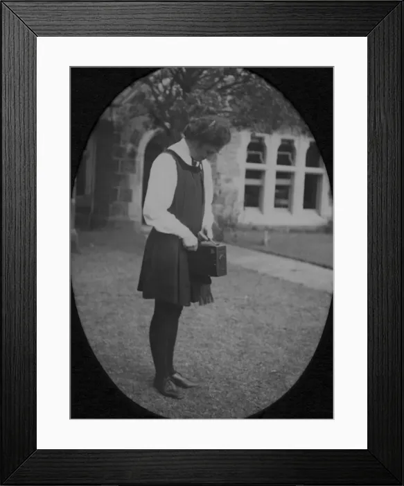 Framed Print : Student standing with box camera Framed Print : Student standing with box camera
