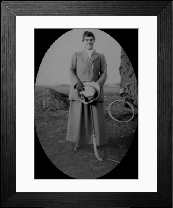 Framed Print : Woman with hockey stick, bicycle and hay rick Framed Print : Woman with hockey stick, bicycle and hay rick
