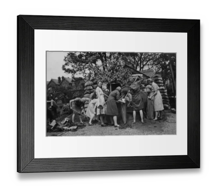Framed Print : WW2 - Women filling sandbags strengthening the Chalet Framed Print : WW2 - Women filling sandbags strengthening the Chalet