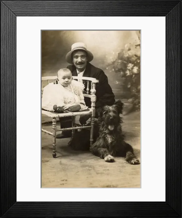 Framed Print : Studio portrait, man with baby and dog, France Framed Print : Studio portrait, man with baby and dog, France