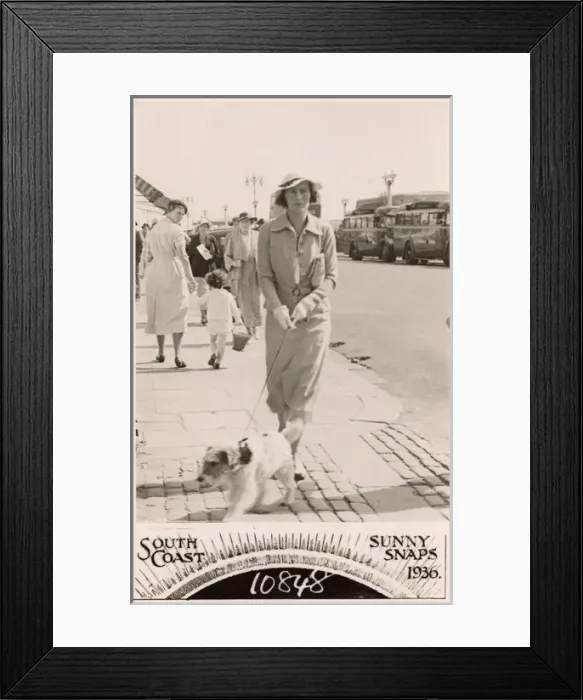 Framed Print : Woman with terrier on a lead at the seaside Framed Print : Woman with terrier on a lead at the seaside